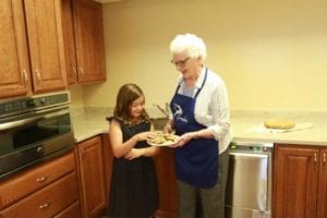 Baking is a great activity for kids and seniors to do together.