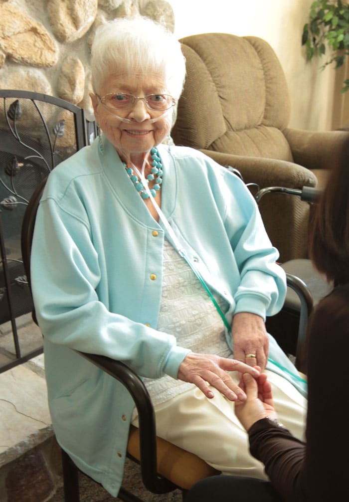 CaringEdge-web2 Elderly woman getting her nail done