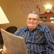 man reading newspaper