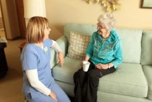 nurse and senior talking
