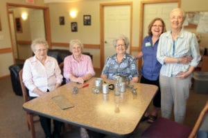 Four Edgewood residents with a caretaker.