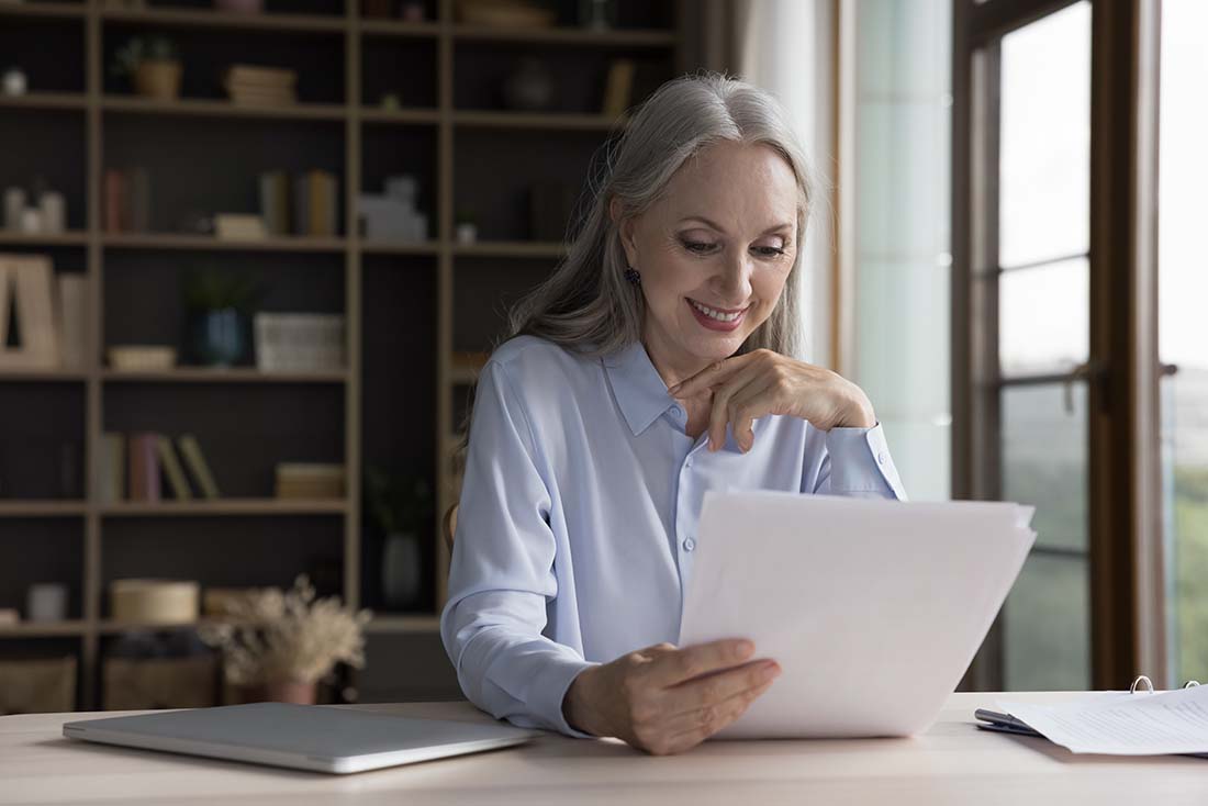 Senior Female Reviewing Document