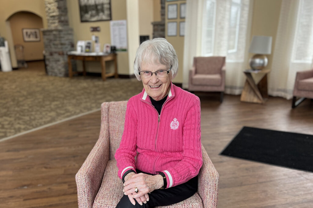 a senior woman sitting on a chair