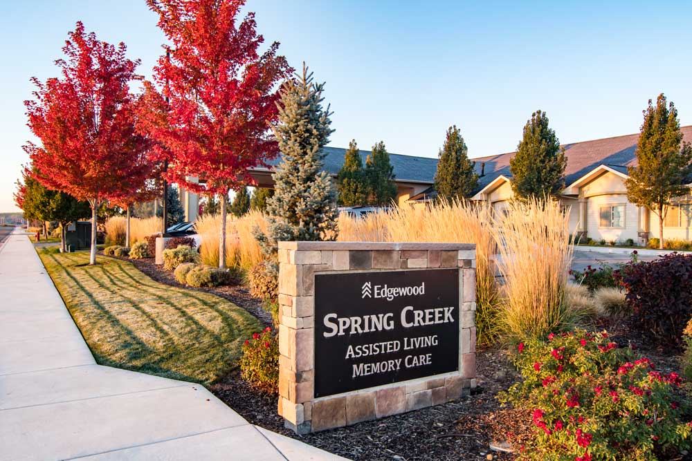 Outdoor sign for Edgewood Spring Creek Assisted Living and Memory Care with Edgewood Logo
