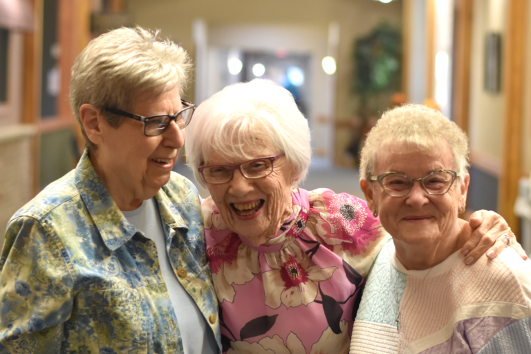 3 senior females sharing a laugh