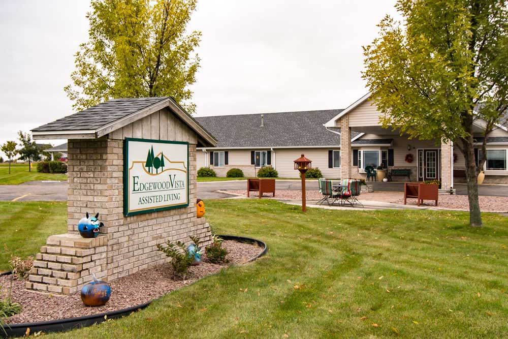 Building exterior sign stating Edgewood Vista Assisted Living