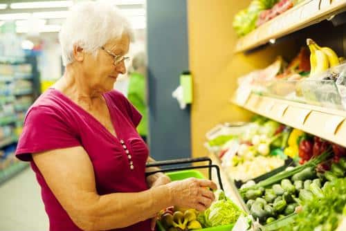 Female senior shopping for produce