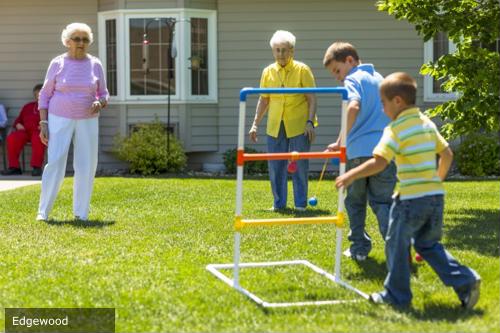Seniors and children playing ladder golf