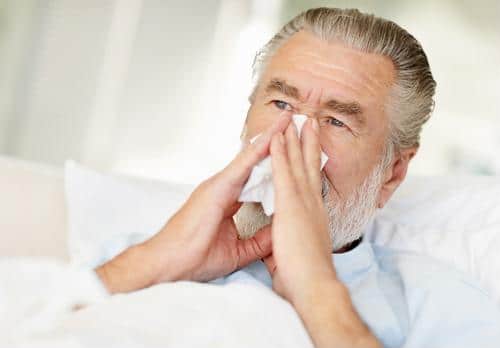 Male blowing nose