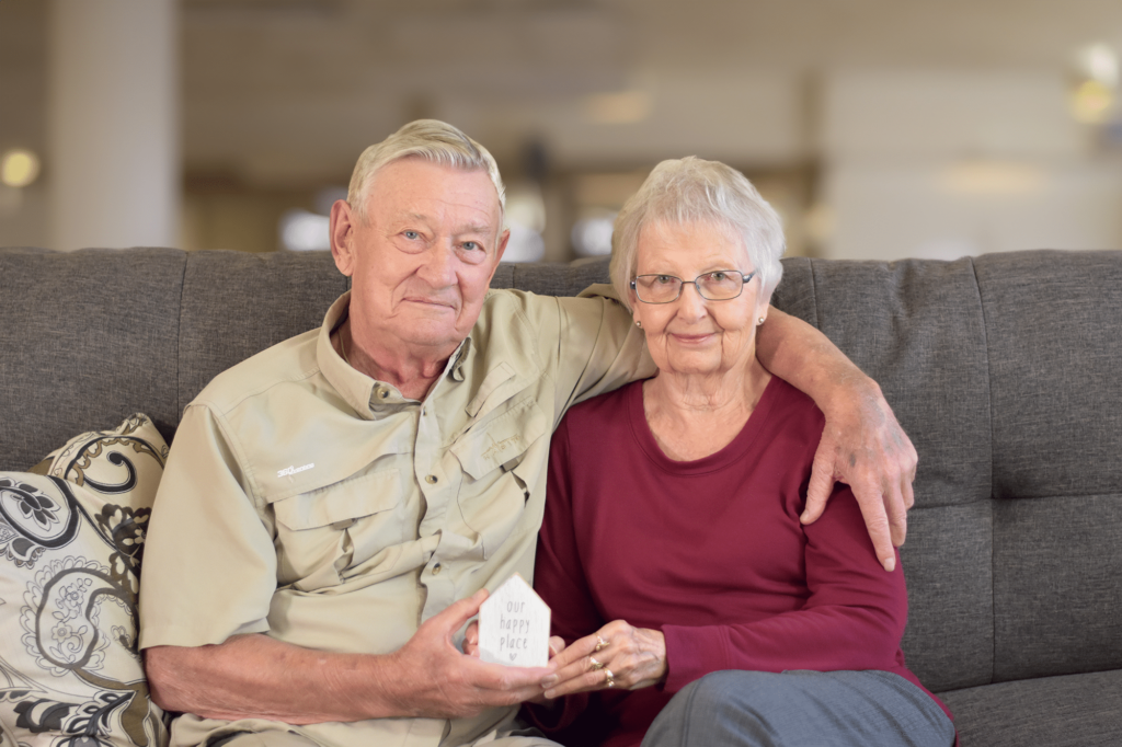 Male senior and female senior seated next to one another