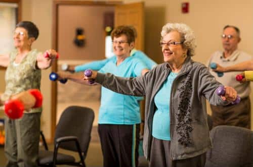 Seniors holding hand weights