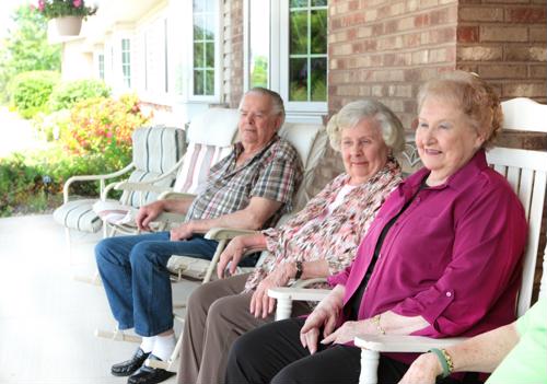 Seniors seated outside on poarch