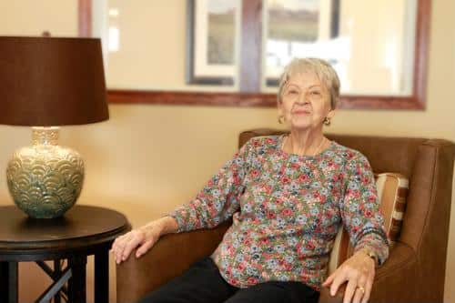 Senior female seated in living area