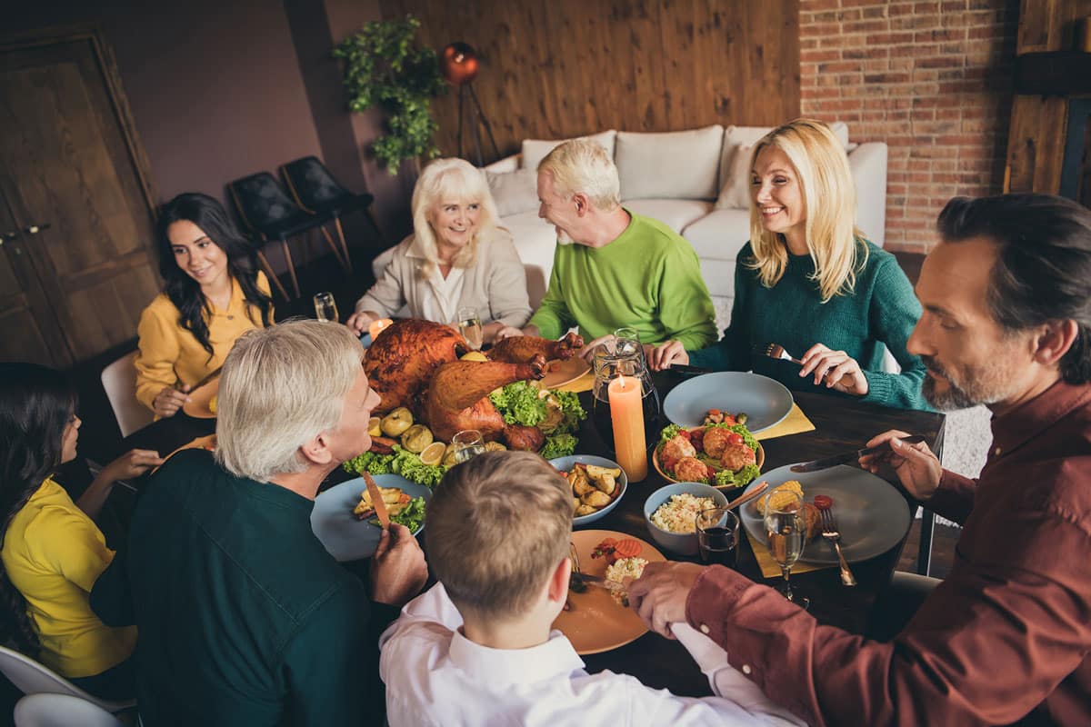 Family seated around table at holiday meal