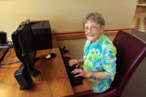Senior female seated at computer