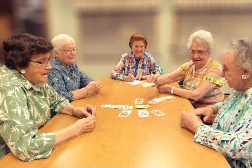 Senior females playing cards