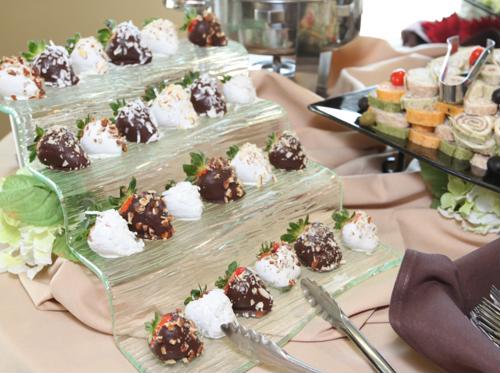 Food on table with serving tongs