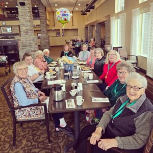 Senior females seated at table