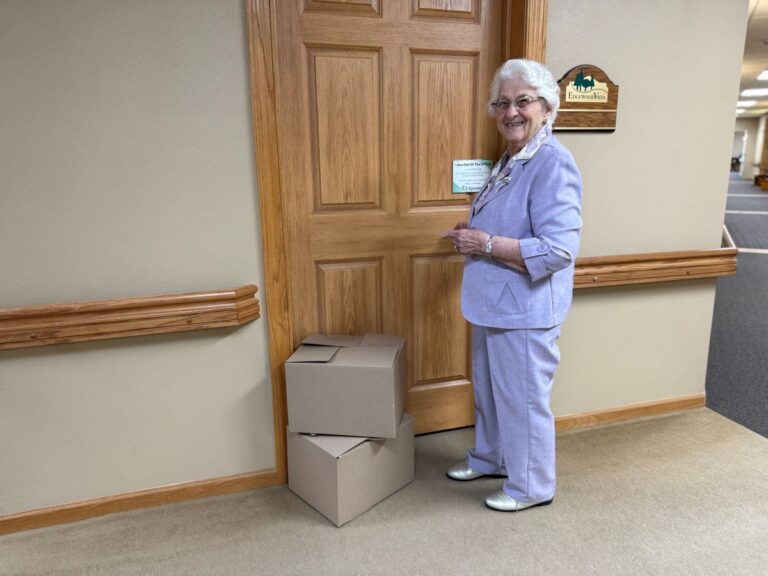 female resident moving into assisted living apartment