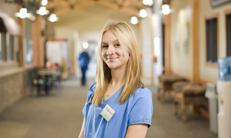 a caregiver in a hallway