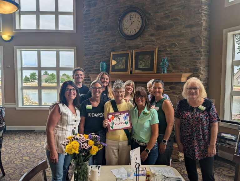 Rose celebrates with friends and Edgewood Fargo team members during an event at Edgewood Fargo.